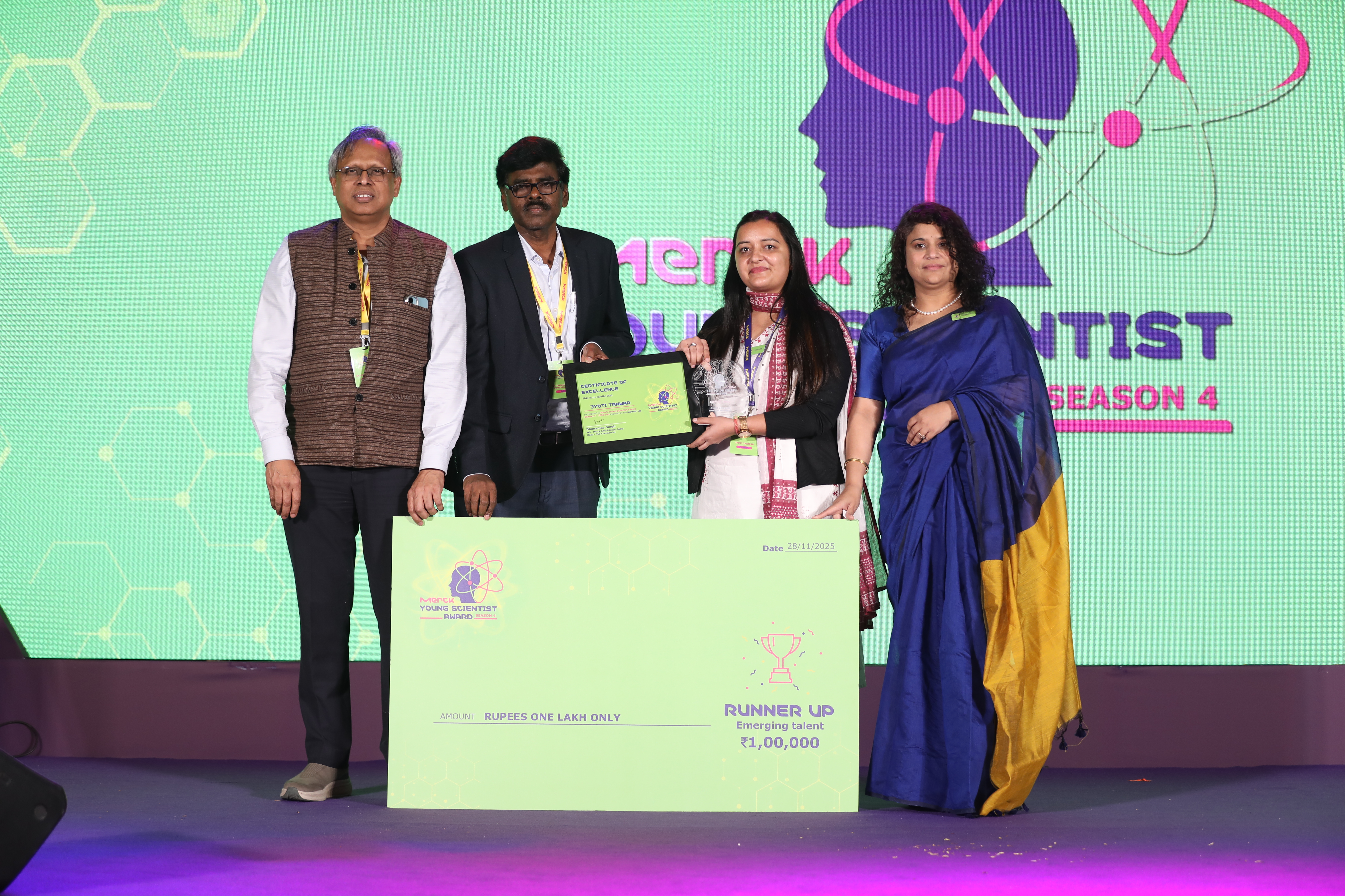 A congratulatory poster from UNESCO–Regional Centre for Biotechnology announcing that Dr. Jyoti Tanwar, INSPIRE Faculty Fellow at RCB, Faridabad, has been awarded Runner-Up in the Emerging Talent (Biological Sciences) category at the Merck Young Scientist Award 2025