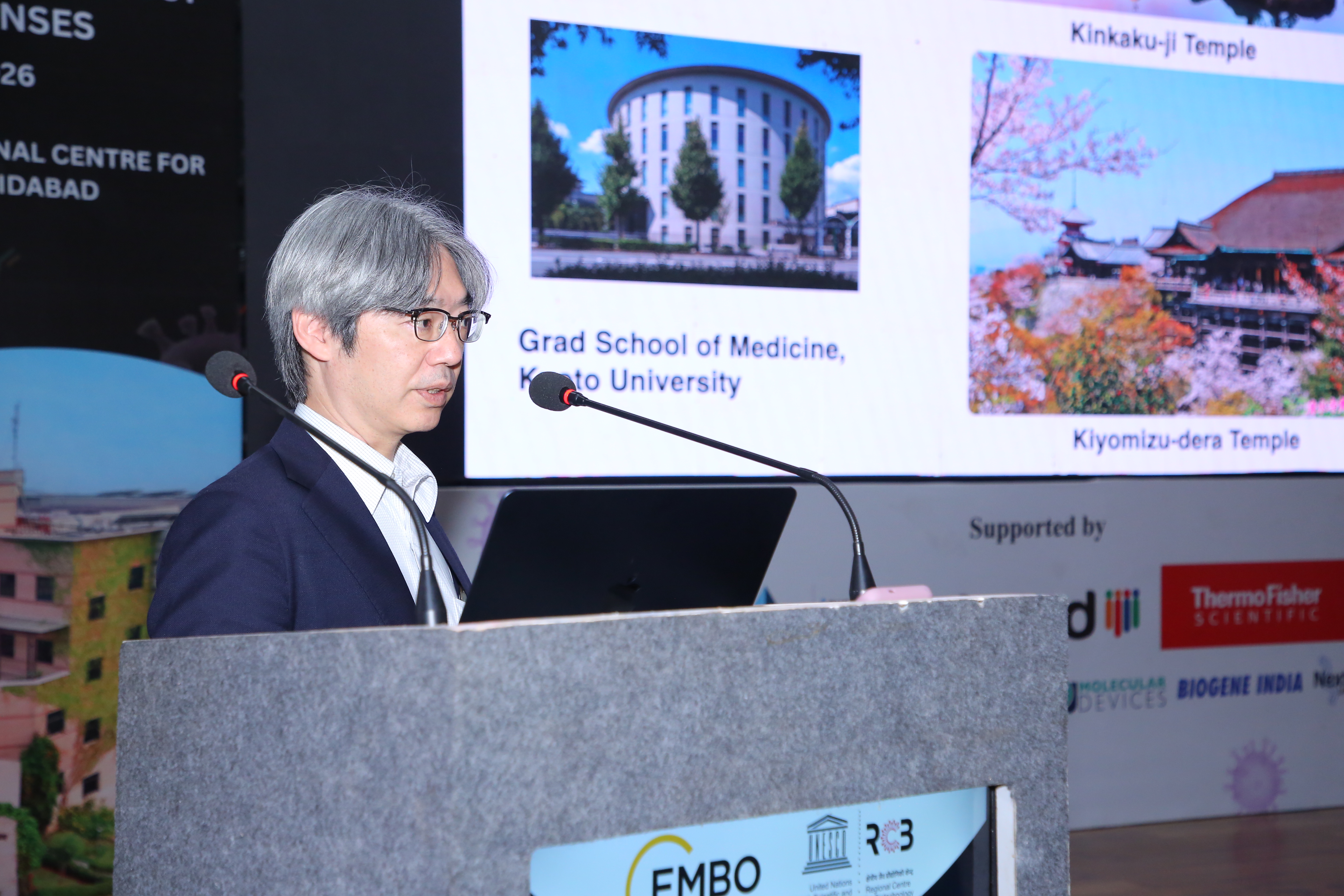 India EMBO Satellite Lecture Course titled “RNA Viruses and Host Immune Responses.” The poster features a dark background with colorful fluorescence microscopy imagery. Event details read: 10 February 2026, Regional Centre for Biotechnology (RCB), Faridabad, MK Bhan Auditorium, 10:00 am. A brief description explains discussions on innate immune responses to RNA viruses. Logos of UNESCO, RCB, and EMBO appear at the bottom, indicating EMBO funding.